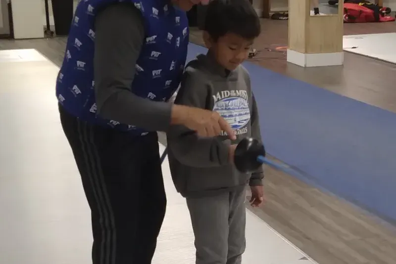 Fencer in action at NJFA