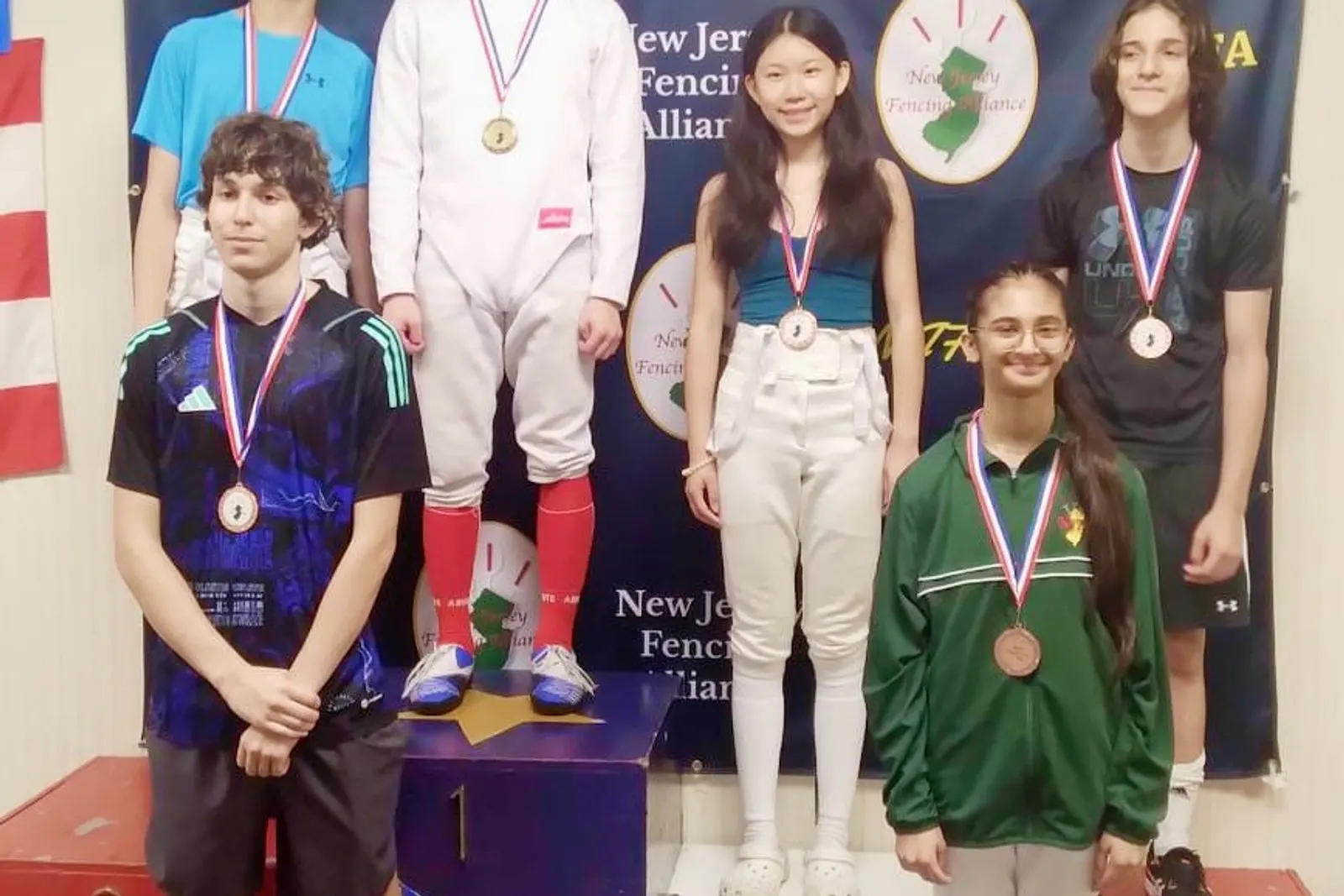Fencers competing on the piste at NJFA